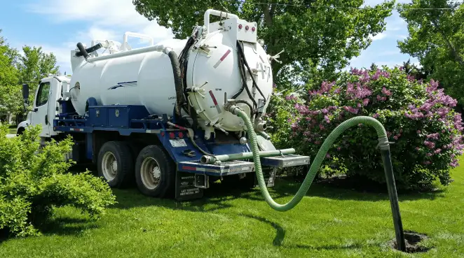 Professional vacuum truck performing residential drainage and septic maintenance in Milwaukee, WI